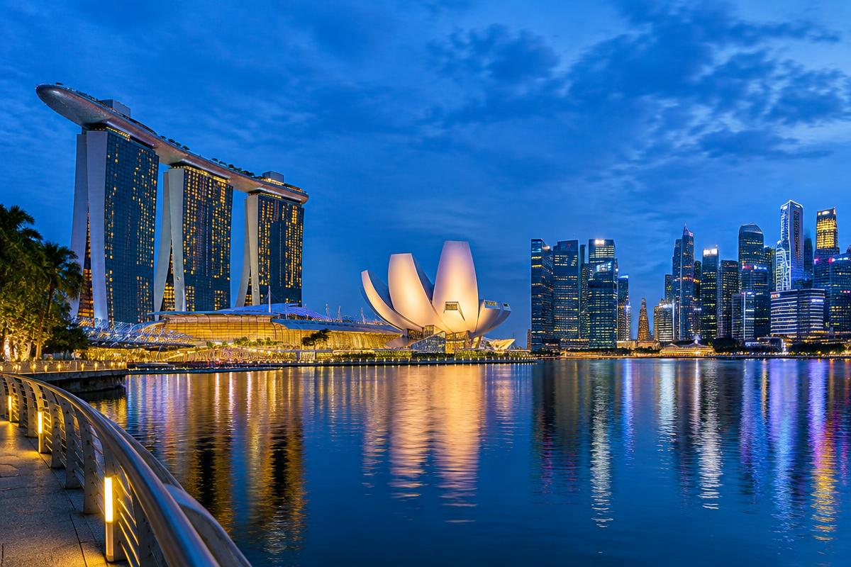 Marina Bay Sands and Singapore skyline reflected at blue hour